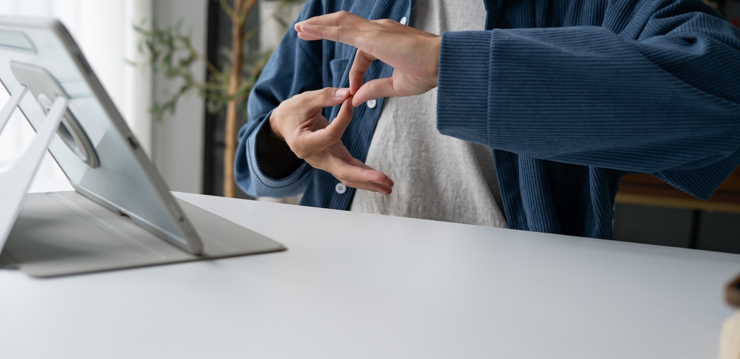 Person using sign language during video call on ta 2026 07 10 23 58 47 utc 1440x700
